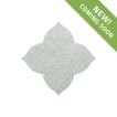 The Angelique waterjet Flower tile in Verde Laguna marble, seen in a tumbled and bush-hammered finish.
