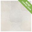 The Angelique Crest + Flower waterjet tile module in Vanilla Ice marble, seen in a tumbled and bush-hammered finish.