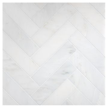 A field of the 1-1/2" X 6" Herringbone mosaic in honed Asian Carrara Ultra Premium marble.