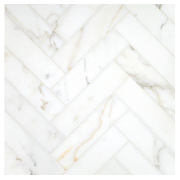 A field of the 1-1/2" X 6" Herringbone mosaic in honed Calacatta Gold marble.