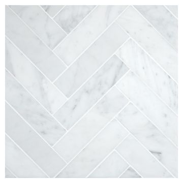 A field of the 1-1/2" X 6" Herringbone mosaic in polished Italian Carrara Light Select marble. A field of the 1-1/2" X 6" Herringbone mosaic in polished Italian Carrara Light Select marble.