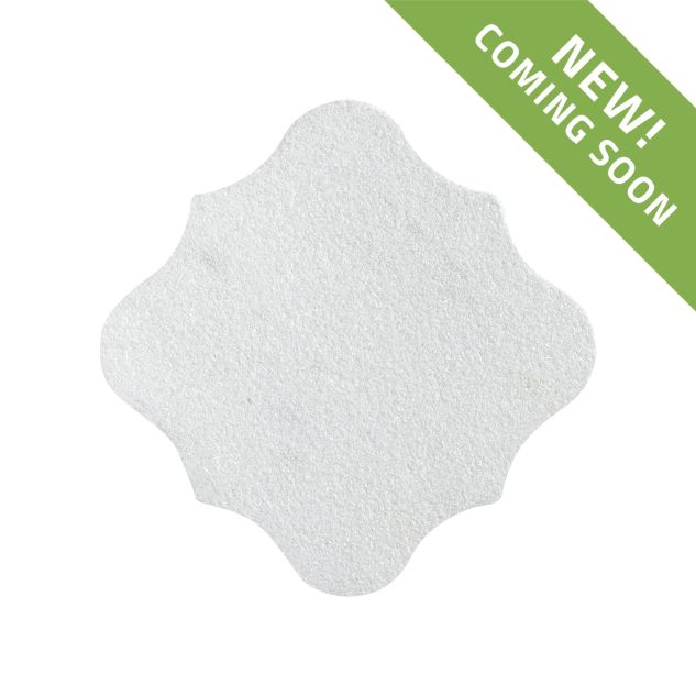 The Angelique Crest Tile in Mugla White marble, seen with a tumbled and bush-hammered finish.