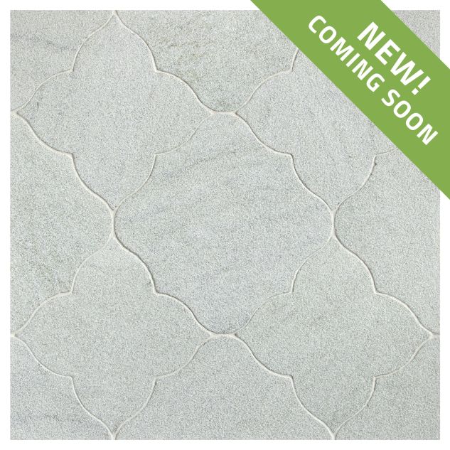 The Angelique Crest + Flower waterjet tile module in Verde Laguna marble, seen in a tumbled and bush-hammered finish.