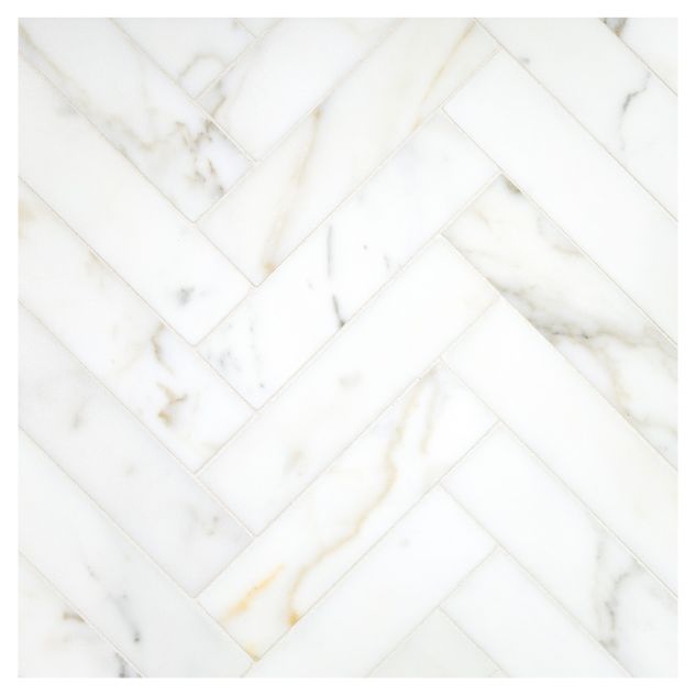 A field of the 1-1/2" X 6" Herringbone mosaic in honed Calacatta Gold marble.