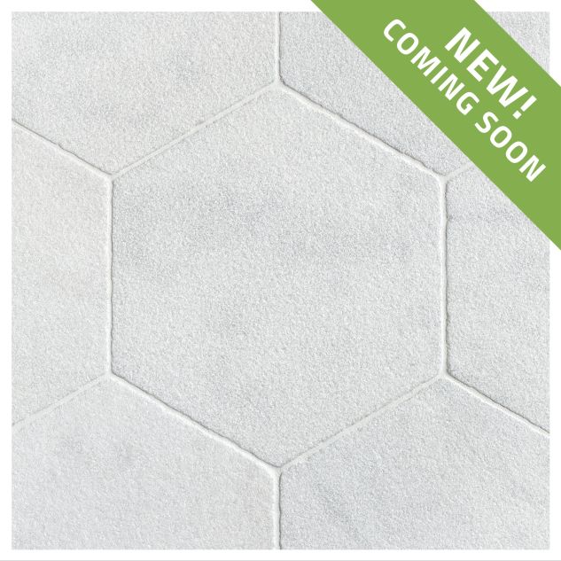 Timeless Tumbled 10-1/2" Hexagon tile in Mugla White marble, seen with a tumbled and bush-hammered finish.